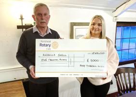 Rebecca Snell receiving her cheque for £1000